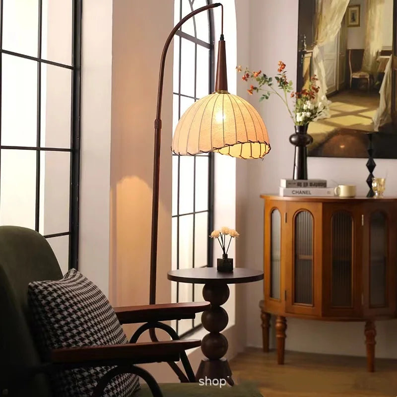 Close-up of mid-century floor lamp with fabric lampshade and round side table base