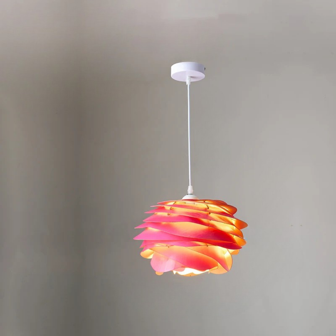 Colorful pendant light with a ribbed design against a plain background