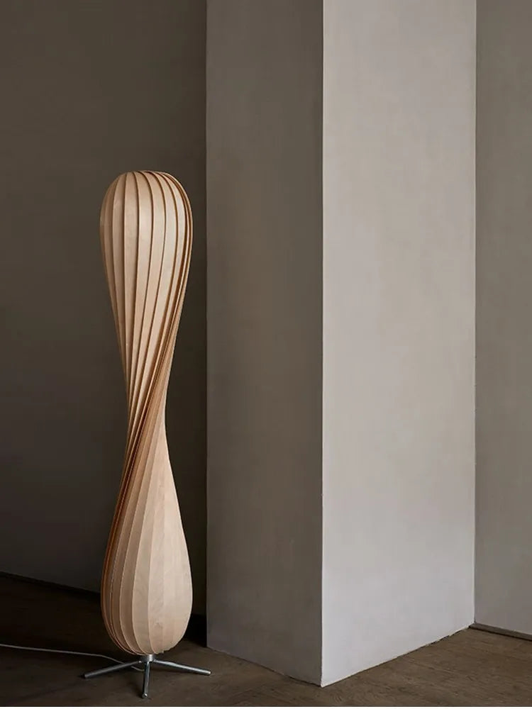 Contemporary standing lamp with curved wood structure and ambient light