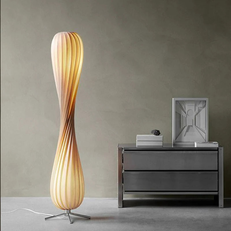 Elegant twisted floor lamp with natural wood finish and soft glow