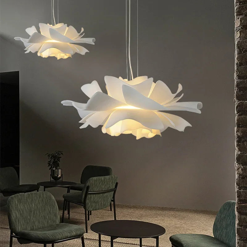 Floral-shaped pendant lights in a modern living room setting.