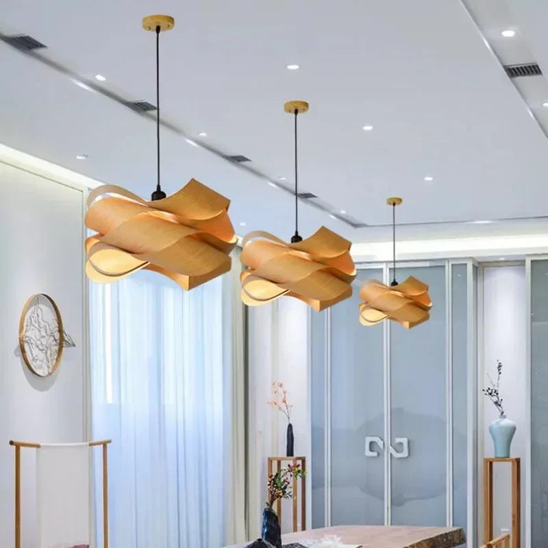 Modern interior design with gold pendant lights in a room with glass walls.