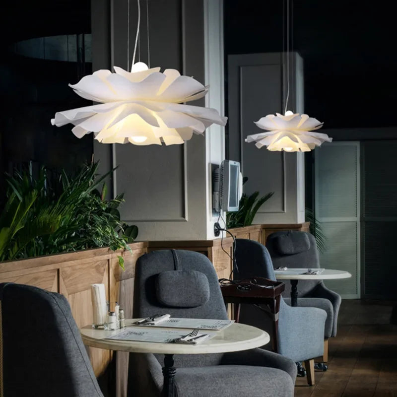 Modern interior with floral pendant lights in a dimly lit room.
