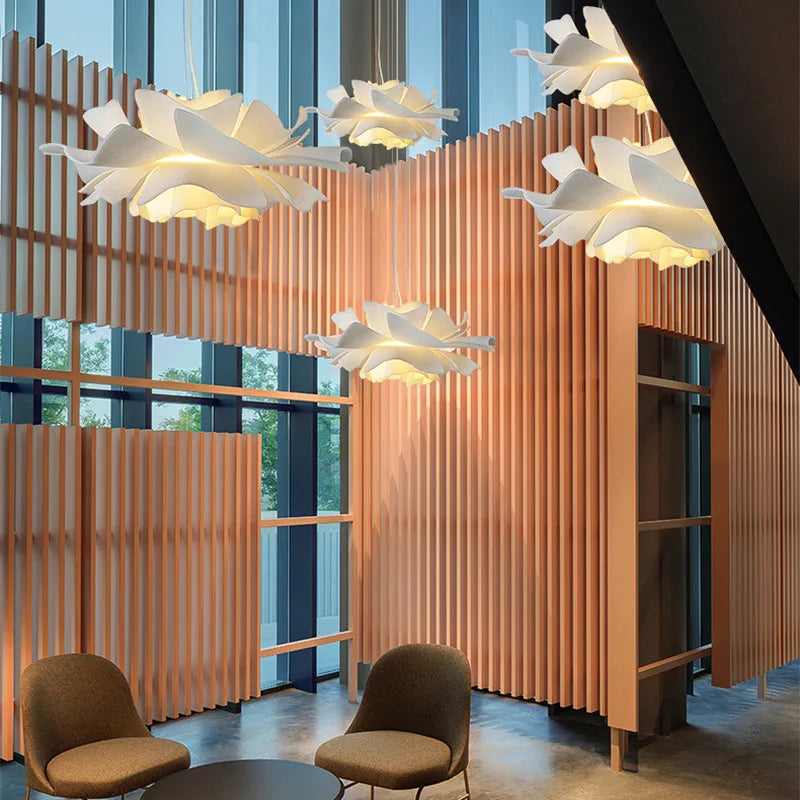 Modern interior with wooden slat wall, floral ceiling lights, and two chairs.