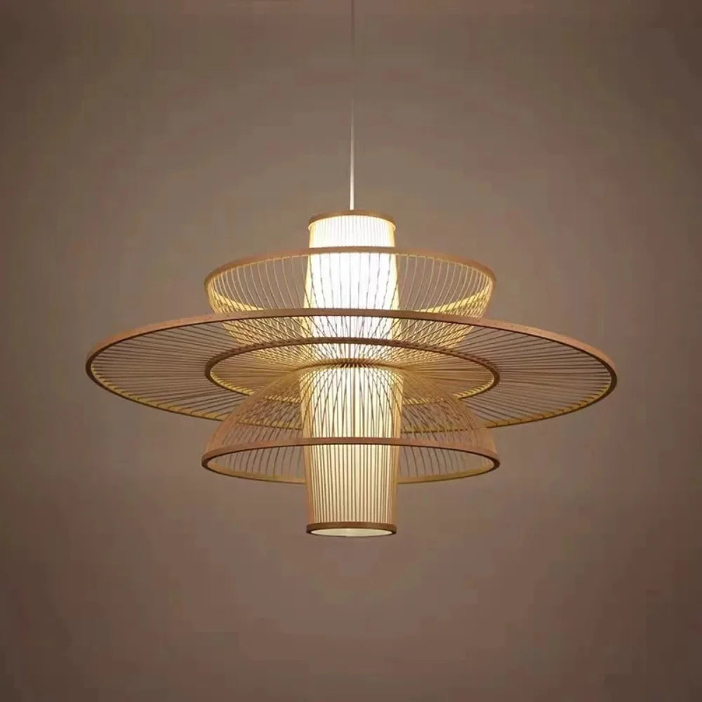 Modern pendant light with gold wireframe design on a neutral background