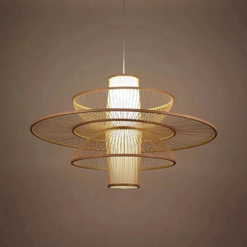 Modern pendant light with gold wireframe design on a neutral background