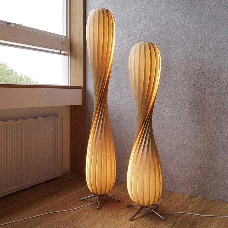 Sculptural wood floor lamp in a minimalist living room setting