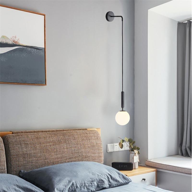black globe wall light bedside