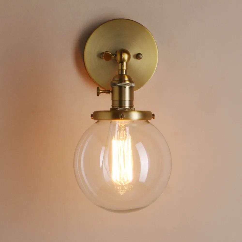 gold wall sconce globe
