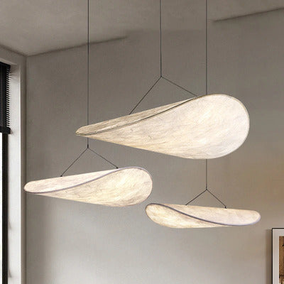 Minimalist Tense Pendant Light hanging over a dining table