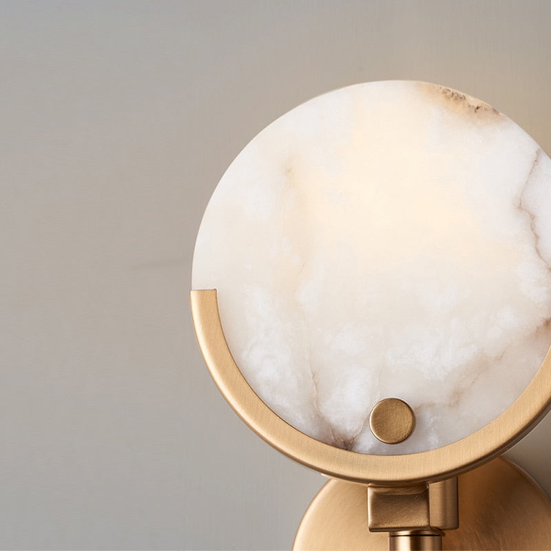 Close-up of luxury marble sconce with warm lighting