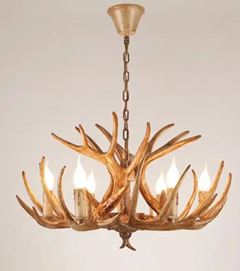Antler chandelier with four lights on a plain background