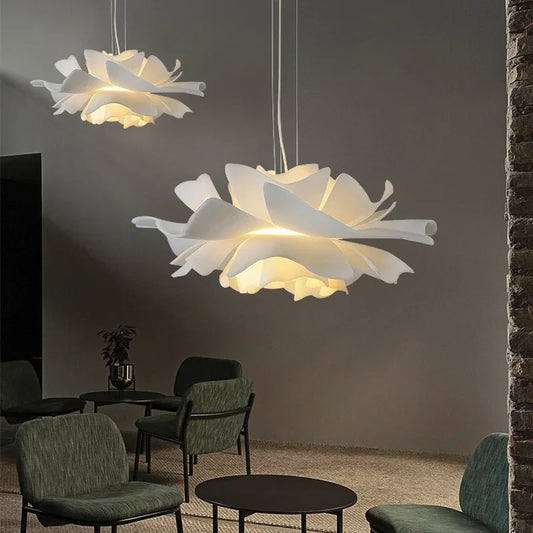 Floral-shaped pendant lights in a modern living room setting.