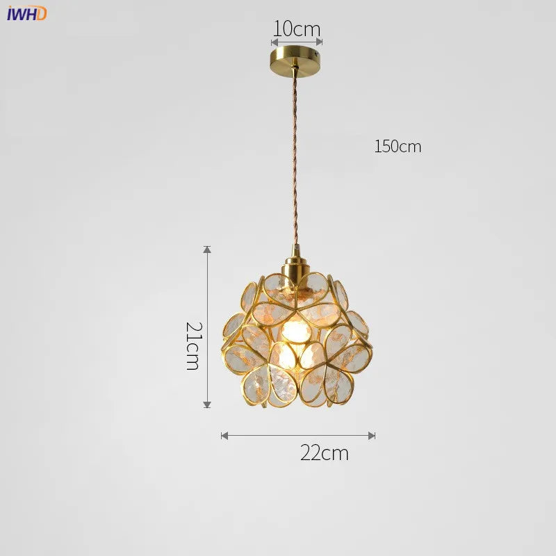 Gold pendant light with measurements on a white background