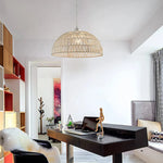 Modern office space with a black desk, chair, and decorative elements.