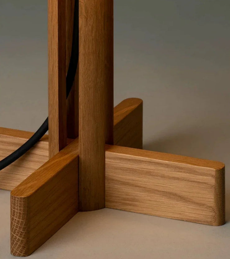 Modern wood-based floor and table lamps in a stylish interior setup