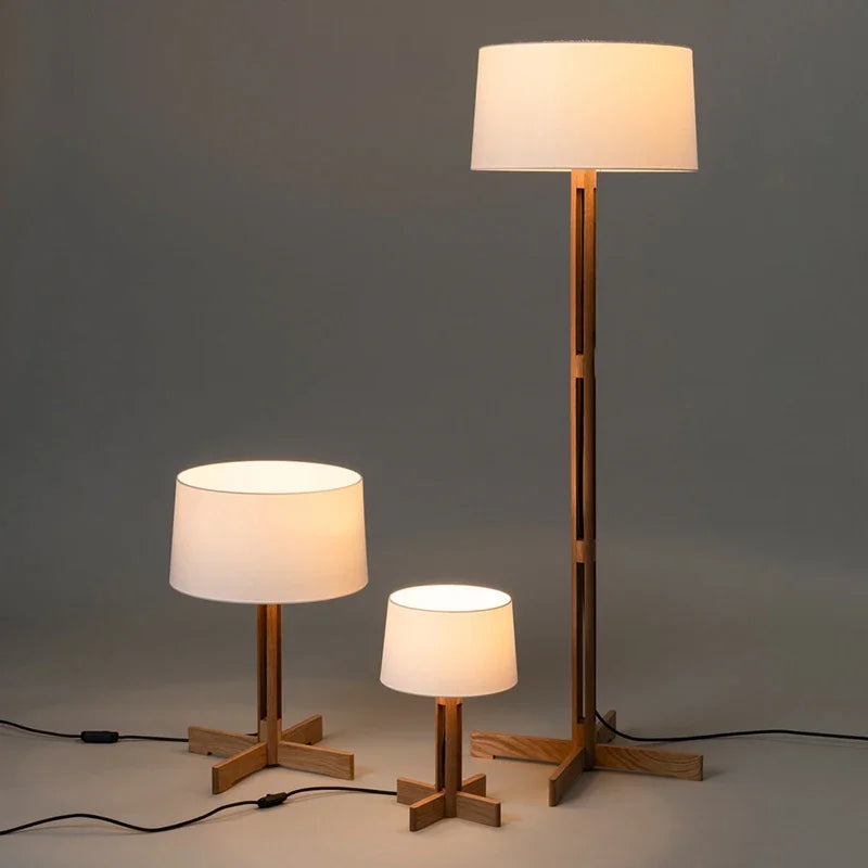 Modern wooden floor lamp with fabric lampshade in minimalist room