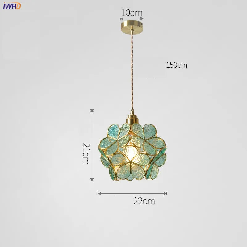 Pendant light with green floral design and measurements on a white background