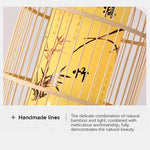 Decorative item with bamboo design and calligraphy on a yellow background