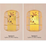 Two views of a pendant light with a yellow shade and floral design, one lit and one not, on a beige background.