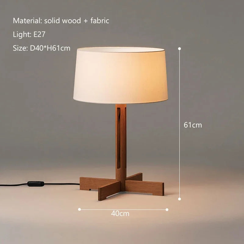Three wooden lamps of different sizes with simple, elegant design