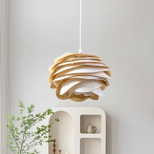 Wooden pendant light hanging in a room with a shelf and plant