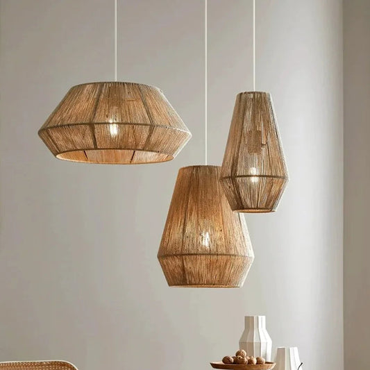 Wooden pendant lights hanging above a dining table with chairs.