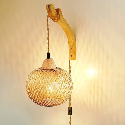 Woven wall light fixture with wooden arm on a neutral background
