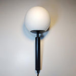frosted globe wall sconce black
