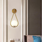 gold globe sconce light