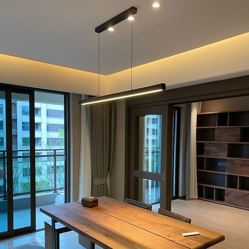 linear chandelier over dining table