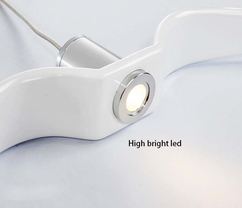 Integrated LED light source on bird wing chandelier