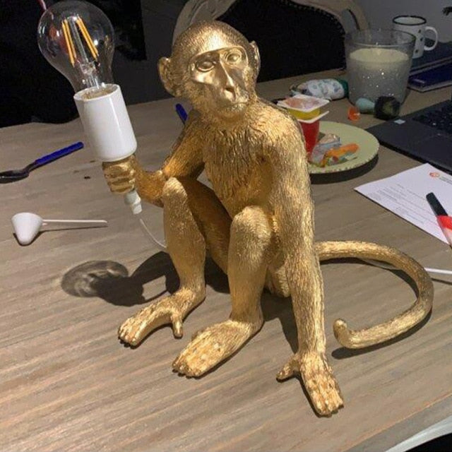 gold moneky lamp sit
