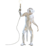 white standing monkey lamps